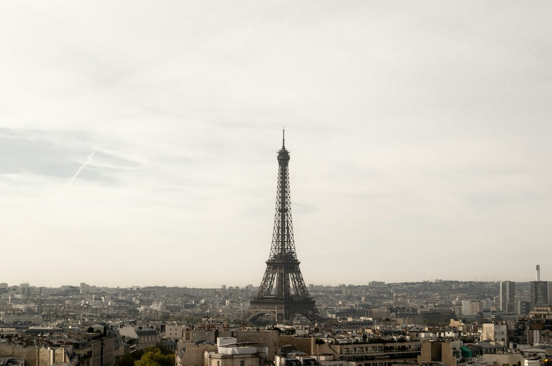 Eiffel Tower in Paris with city rooftops