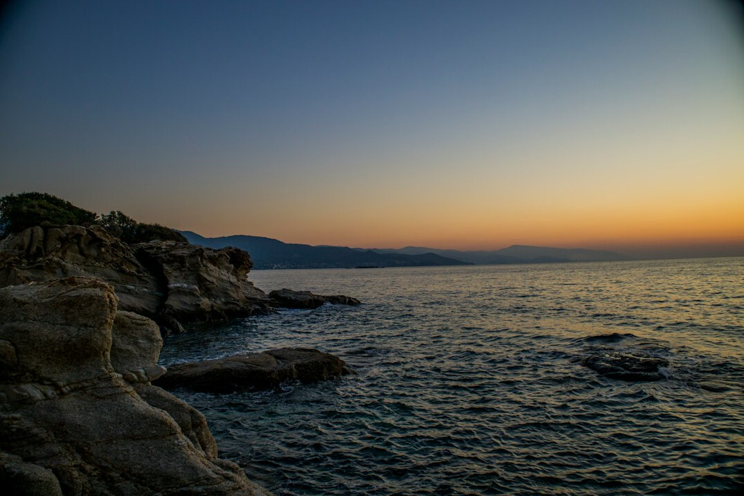 secret greek beach at sunset