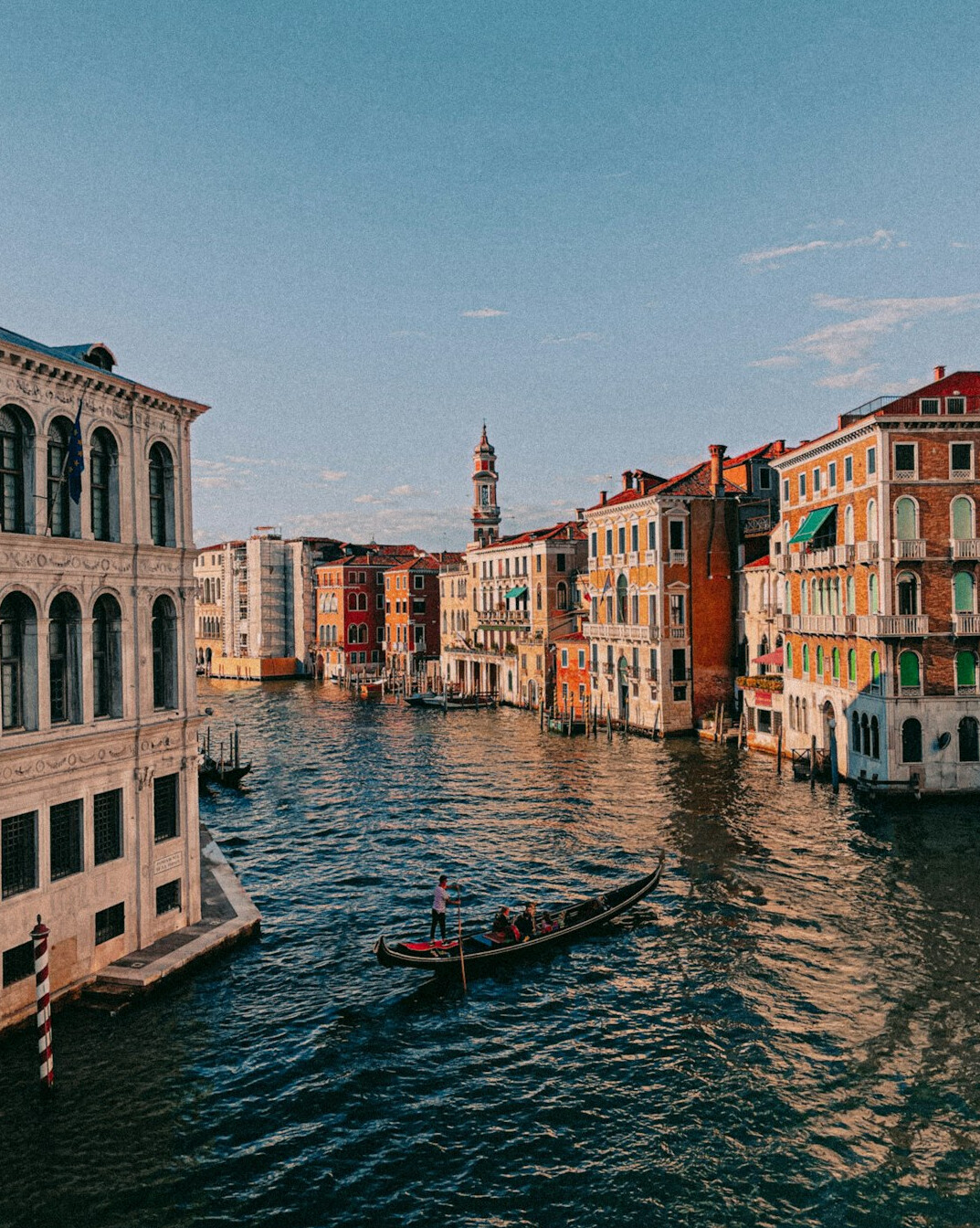 Venice canal with gondolas and historic buildings